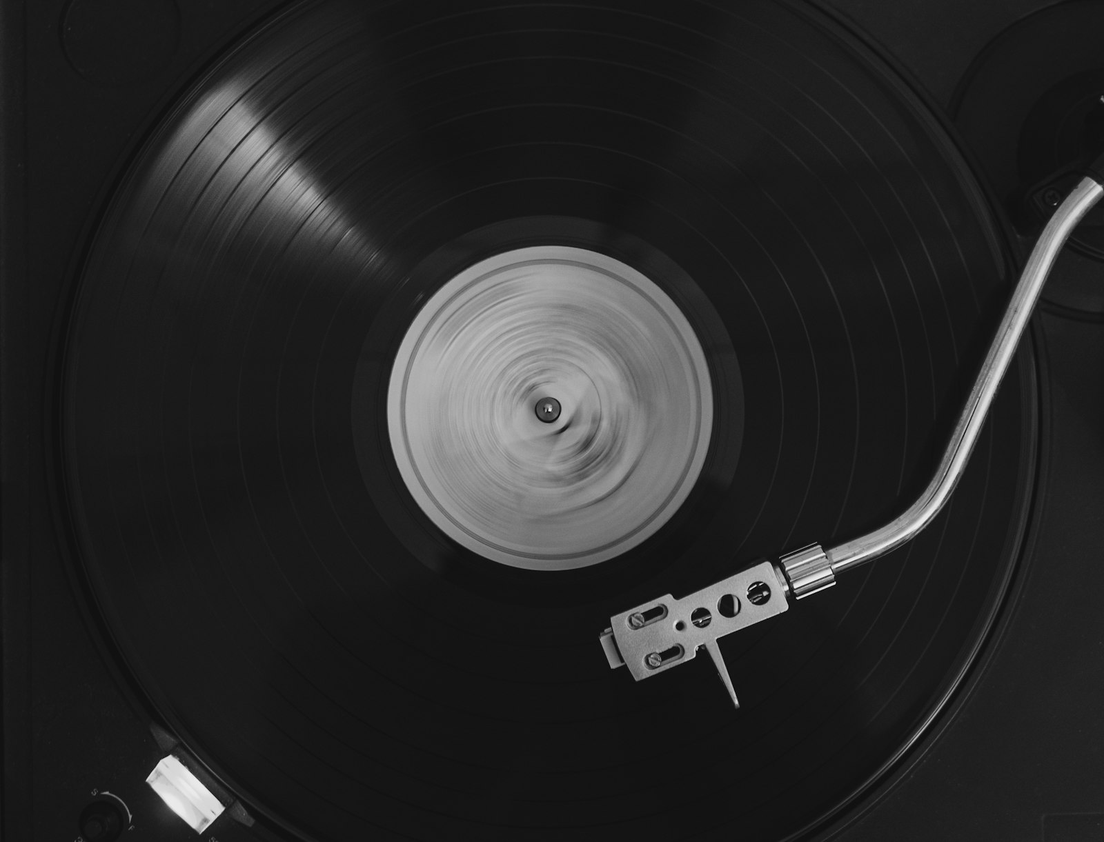 Black vinyl record spinning on a turntable